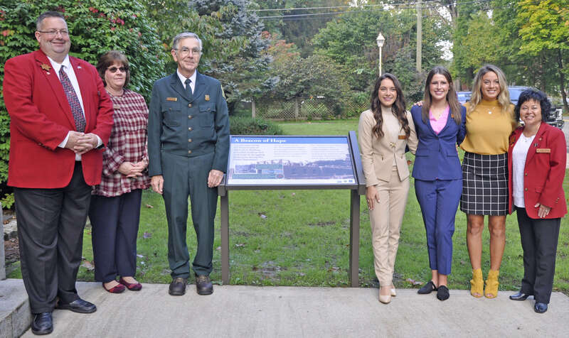 Forest Supervisor Clyde Thompson, Mountain State Forest Festival director Rich Nida and wife Marsha Nida, Maid Silvia Alia Figueroa and her Maids of Honor Hannah Shiflett and Grace Lindsey and the Director of Queen's Department Peggy Phillips, stand