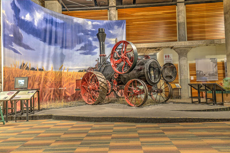 Steam-powered traction engine - 14 horsepower. Made by Minnesota Thresher Manufacturing Company of Stillwater.