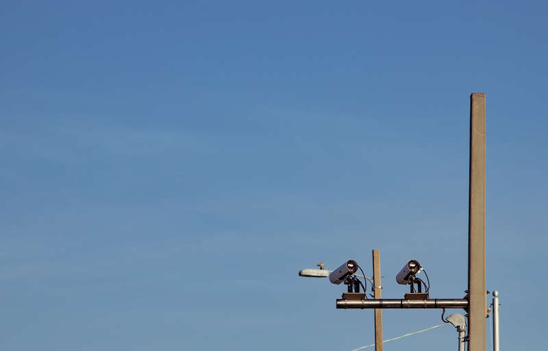 Automated license plate reader (ALPR/LPR) cameras scan license plates of cars crossing into Pensacola Beach, Florida