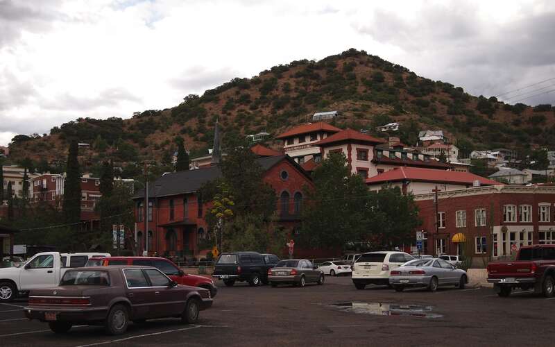 Downtown Bisbee, as seen from the parking lot at the intersection of Brewery Avenue and Tombstone Canyon Road.Photo taken with an Olympus E-P1 in Cochise County, AZ, USA.Cropping and post-processing performed with The GIMP.