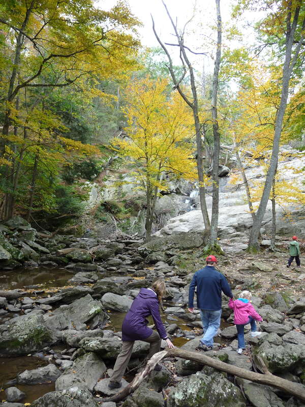 A family crossing Big Hunting Creek to Cunningham Falls
