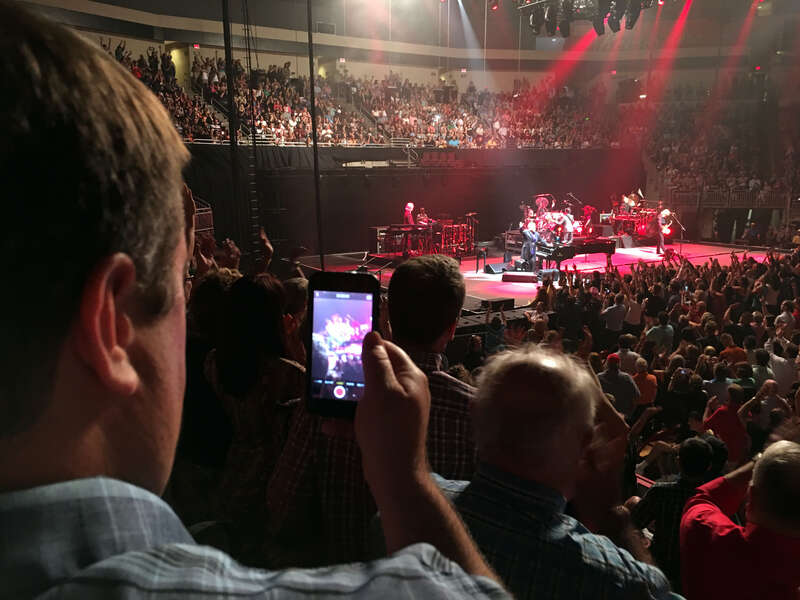 This guy watches the whole concert looking at his phone.