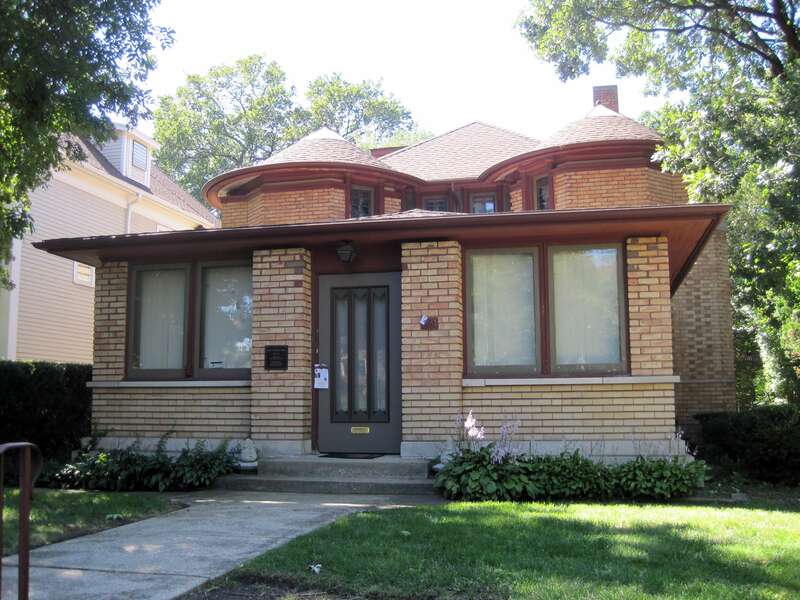 The George W. Furbeck House in the Frank Lloyd Wright-Prairie School of Architecture Historic District in Oak Park (1898). It was one of his transitional houses as he moved from refined Queen Anne houses to the Prairie School design. The fronch porch