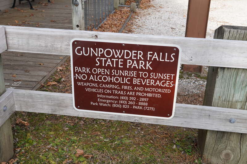 A brown plaque/sign at Monkton railroad station reading 
GUNPOWDER FALLS STATE PARK
PARK OPEN SUNRISE TO SUNSET
NO ALCOHOLIC BEVERAGES

WEAPONS, CAMPING, FIRE, AND MOTORIZED VEHICLES ON TRAILS ARE PROHIBITED.