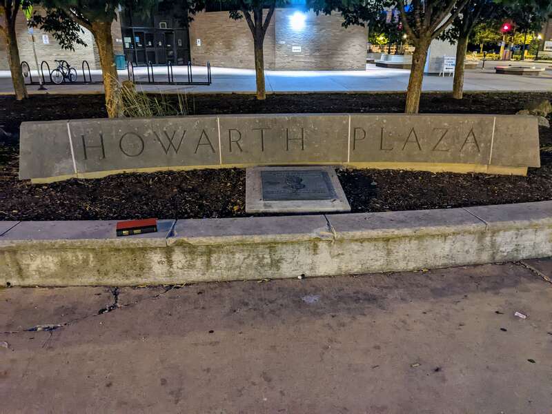 Commemorative sign and plaque located on the south side of Howarth Plaza in Springfield, Illinois