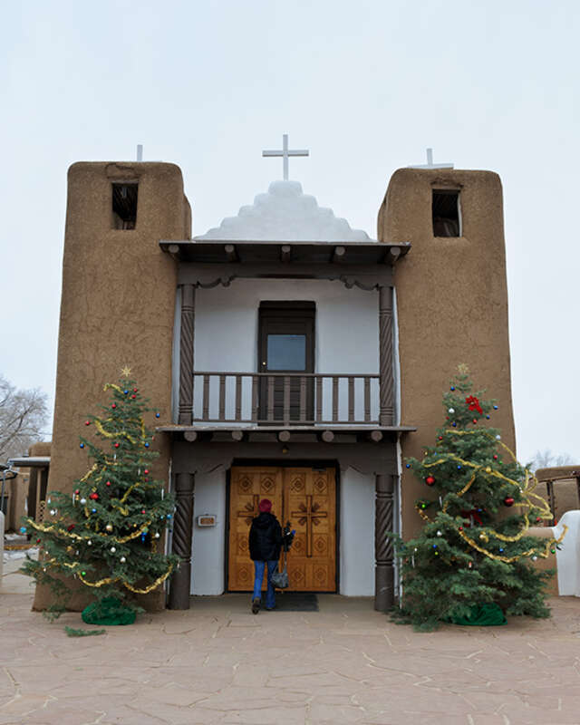 Jacki about to enter the old church on the Taos pueblo