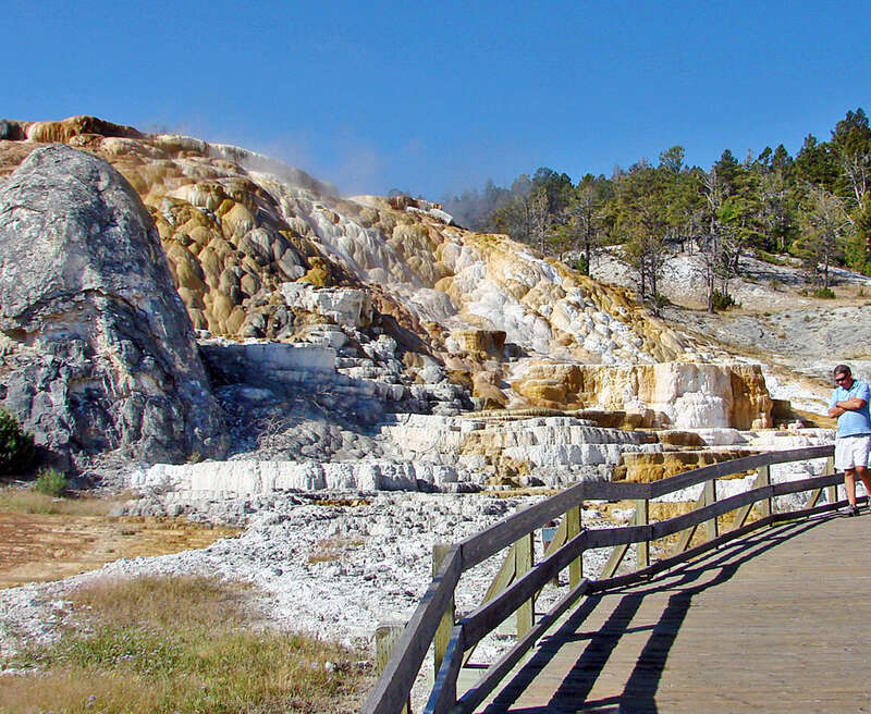 (1 in a multiple picture album)
Normally I don't like to have people in my landscape shots, but I left this one in to give a scale of the travertine terraces that have been built up for eons by super hot water passing through limestone.  Yes, that is