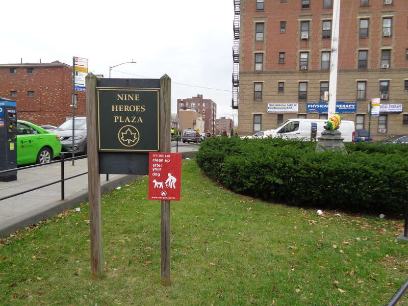 A classic Parks Department sign at the east end of the Nine Heroes Plaza / Vietnam Veterans Triangle, on the south side of Broadway at 76th Street and 41st Avenue in Elmhurst, Queens.
