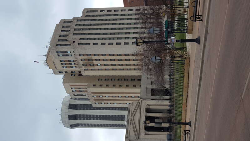 Photo featuring buildings of the Springfield, Illinois skyline: namely Wyndham Springfield City Centre (Hilton Springfield) and the Illinois Building located at 607 E. Adams.