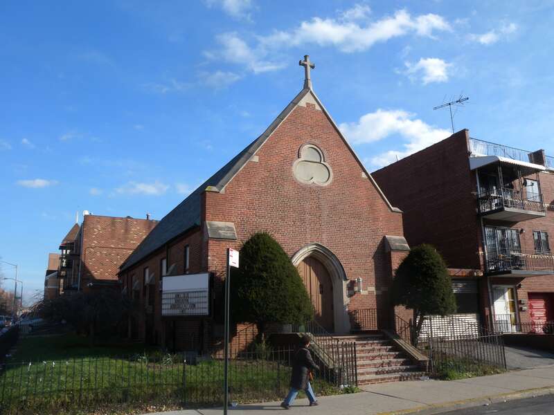 Looking east across 75th Street at United Sherpa Association, formerly St Matthew's Lutheran Church for the Deaf, on a sunny afternoon.