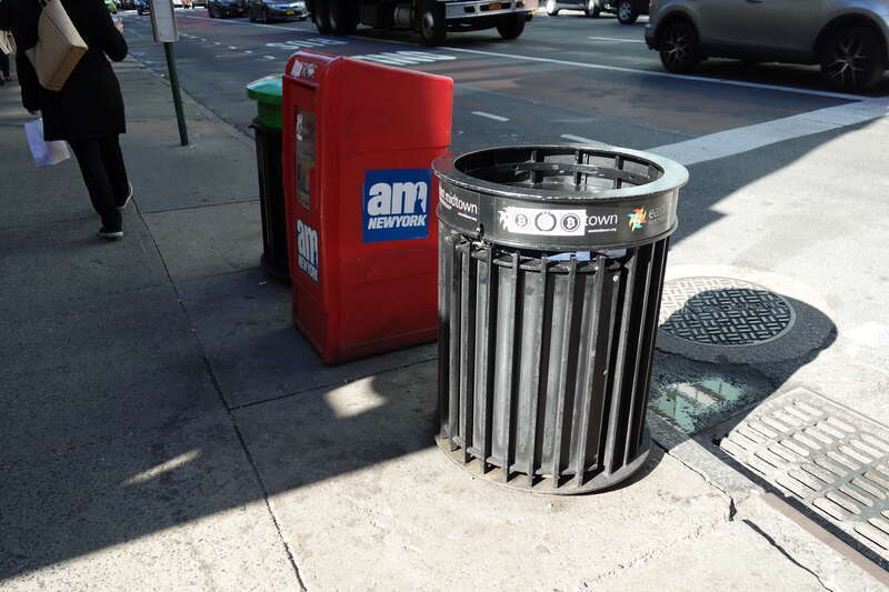 A trash can and newspaper box at 3rd Avenue and 51st Street in East Midtown Manhattan.