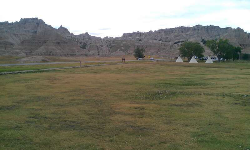 Badlands of South Dakota with Native American-style Tipis