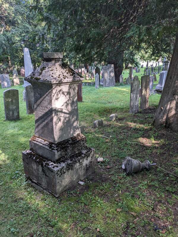 Broken memorial in Old South Church Cemetery, 146 Main Street in downtown Windsor, Vermont.