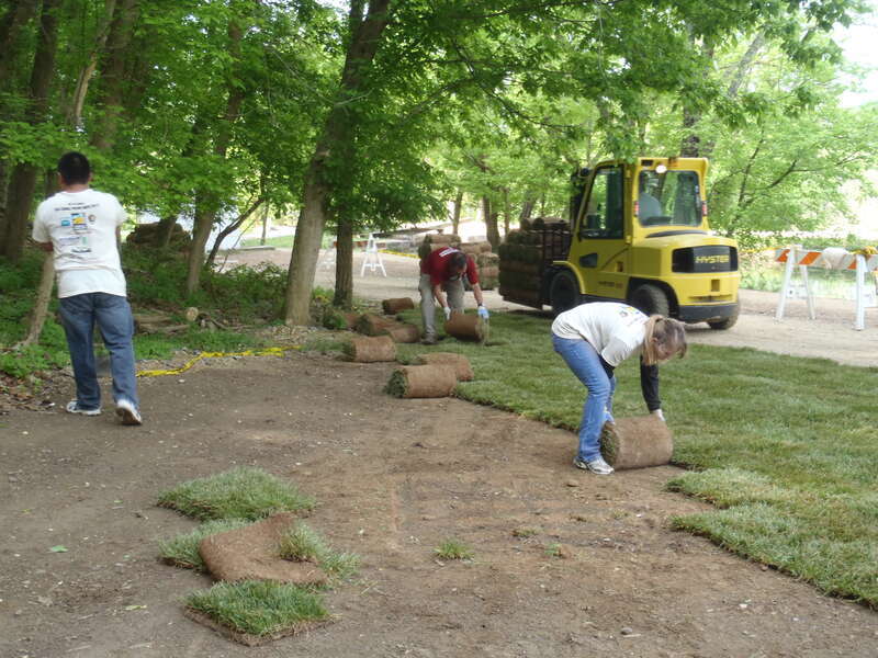 Volunteers laying 13050 sq ft of sod at the Great Falls Tavern grounds.