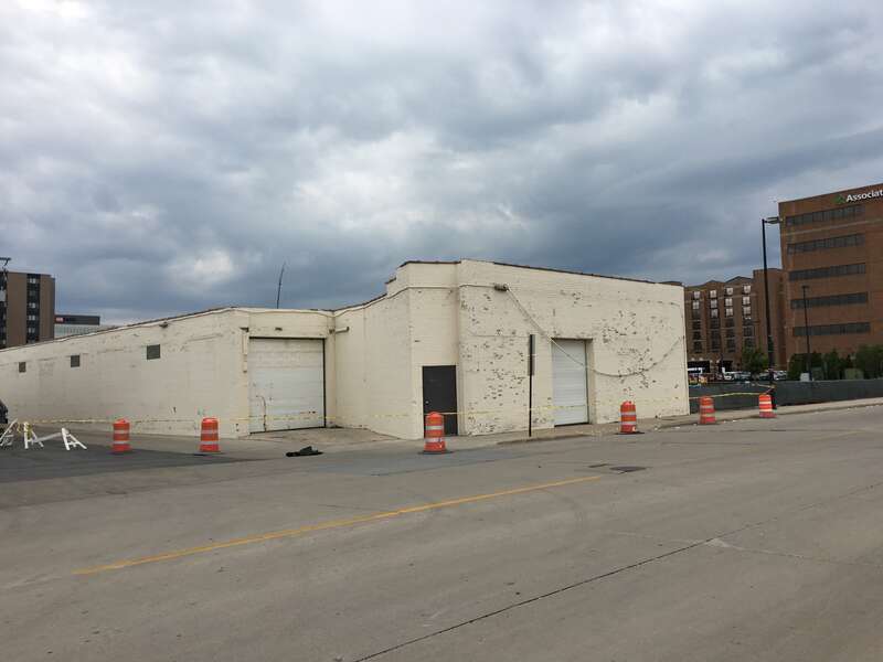 Demolition of a warehouse and office building adjacent to Camera Corner in downtown Green Bay, WI. Camera Corner is set to expand to this area.