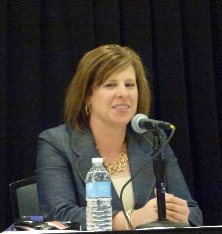Cori Close, head coach of the UCLA women's basketball team, speaking at a WBCA conference in Nashville, Tennessee.