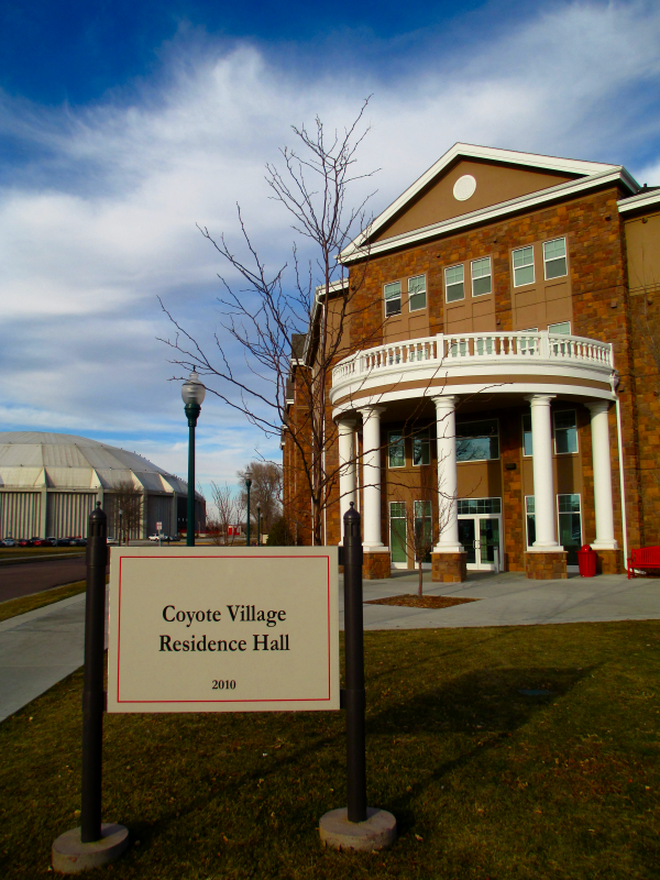 University of South Dakota residence hall Coyote Village and sports facility DakotaDome. North facing shot of the most western portion of the residence hall.