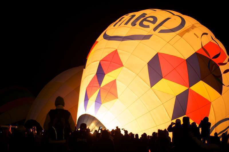Dawn Patrol is a small group of balloons that go up before the rest to check conditions. They light up before dawn for a 5:45am departure. Albuquerque International Balloon Fiesta, 2012. Over 750 ballons on site.