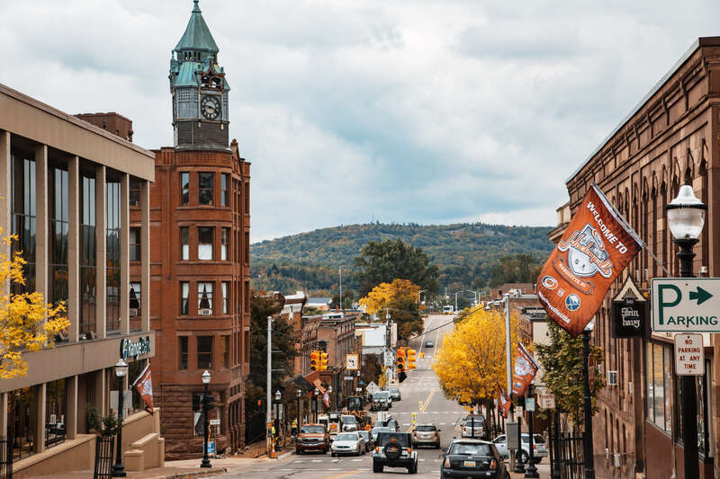 Downtown Marquette, Michigan, as seen from North Front Street in autumn, with a Kraft Hockeyville banner.