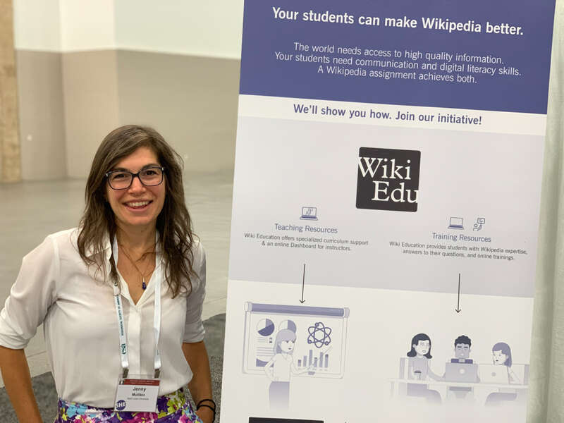 A student in a Wiki Education visits our booth at the Ecological Society of America conference exhibit hall.