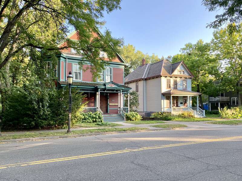 The Knox-Austin House, on the left, was built in 1885 and was designed in the Queen Anne style by James Knox Taylor.  The house was once home to Horace Austin, former governor of Minnesota (1870-1874).  The house on the right was built circa 1905 in