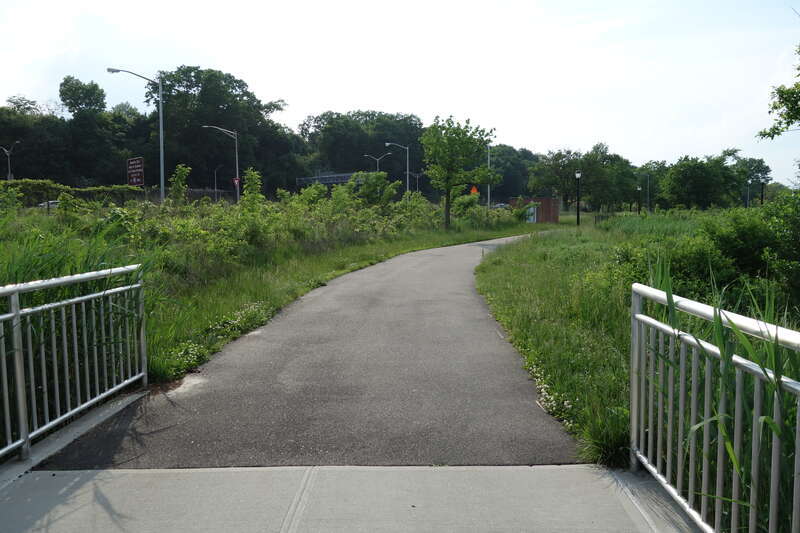 A newly-constructed footbridge on the promenade around Meadow Lake in the Meadow Lake section of Flushing Meadows–Corona Park, on Meadow Lake Drive near Jewel Avenue / 69th Road between Forest Hills and Queensboro Hill, Queens. The bridge crosses a