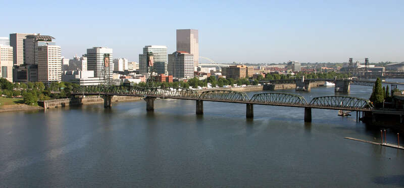 The Hawthorne Bridge in Portland, Oregon viewed from the south from atop the Marquam Bridge.
