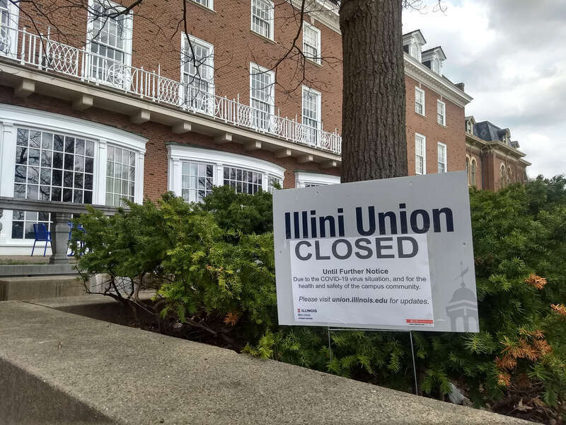 Signage from April 2020 posted outside the Illini Union at the University of Illinois at Urbana–Champaign. The sign states that the facility is closed because of the COVID-19 pandemic.