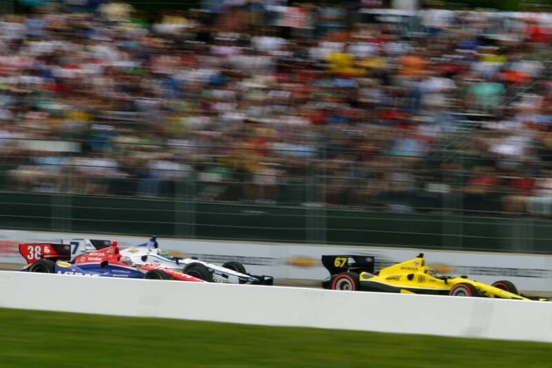 Josef Newgarden ahead of Sebastian Bourdais and Josef Newgarden during the 2012 Detroit Belle Isle Grand Prix
