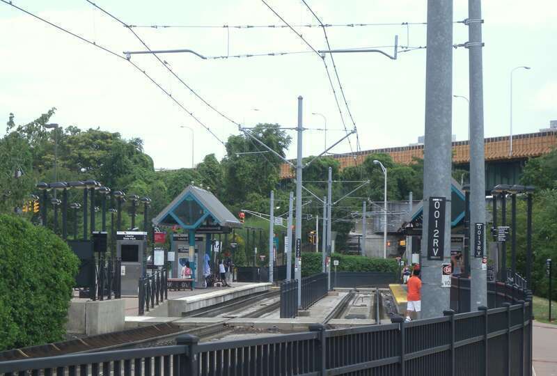 Looking northeast, full zoom, at Liberty State Park station on a cloudy midday.  I-78 in background.