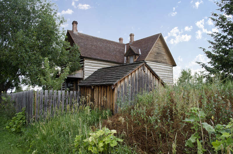 Looking southwest past the root cellar at the house on the grounds of the Tinsley Living Farm at the Museum of the Rockies in Bozeman, Montana.
The house was constructed in 1889 by William and Lucy (Nave) Tinsley. William Tinsley worked for Wells