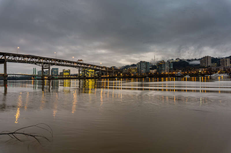 Sunrise in Portland, Oregon, in the early winter of 2016.  Visible below (and beyond) the Marquam Bridge are the South Waterfront District and the cable-stayed Tilikum Crossing bridge, and to the right of the Marquam Bridge is the RiverPlace