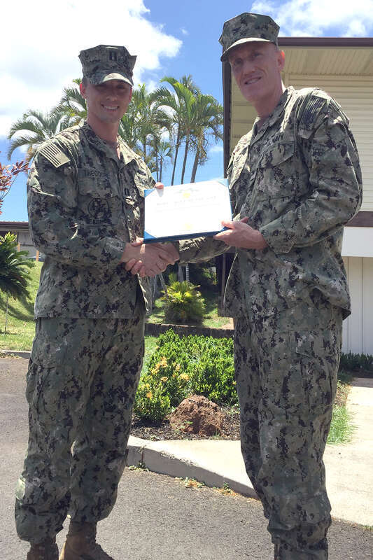 PEARL HARBOR-HICKAM, Hawaii (May 10, 2017) Naval Facilities Engineering Command (NAVFAC) Hawaii Commanding Officer Capt. Richard Hayes III presents a Navy and Marine Corps Commendation Medal to Lt. Benjamin W. Theodore May 10 at Joint Base Pearl