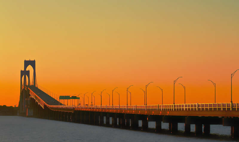 500px provided description: A sunset reflection off the bridge [#travel]