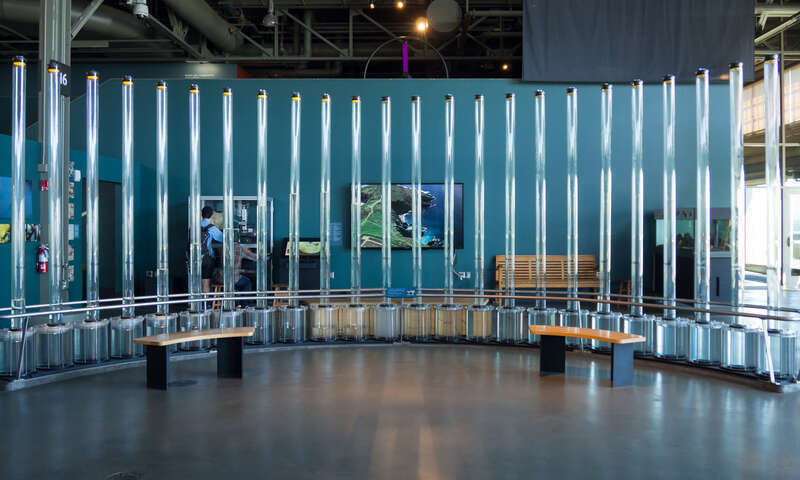 Tidal Memory exhibit at the Exploratorium. The clear columns fill with water according to local tide data to illustrate tidal patterns.