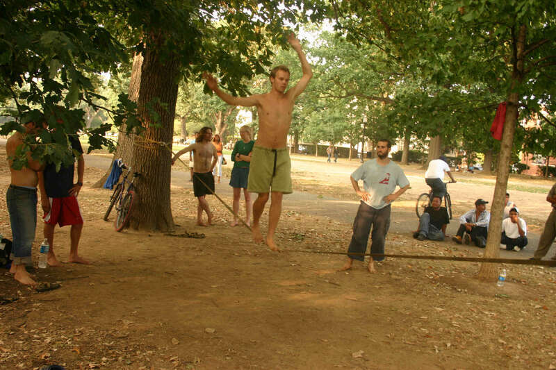 Tightrope walking during a drum circle taking place at Meridian Hill Park, a National Historic Landmark located in the Columbia Heights neighborhood of Washington, D.C.