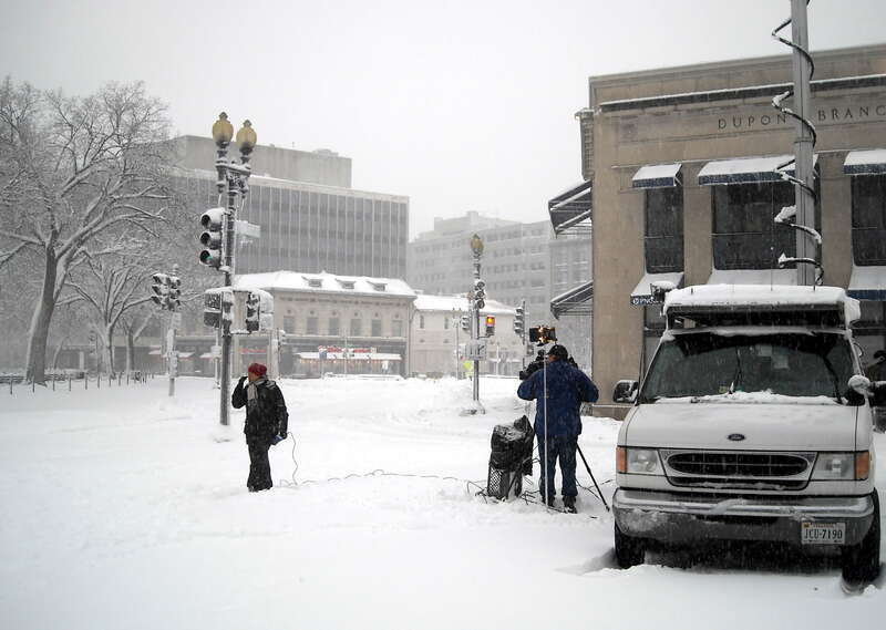 On-the-scene reporting for WJLA-TV during the North American blizzard of 2010. The news crew is standing on the north side of Dupont Circle in Washington, D.C.  The PNC Bank, Dupont Circle branch, is visible on the right-hand side.