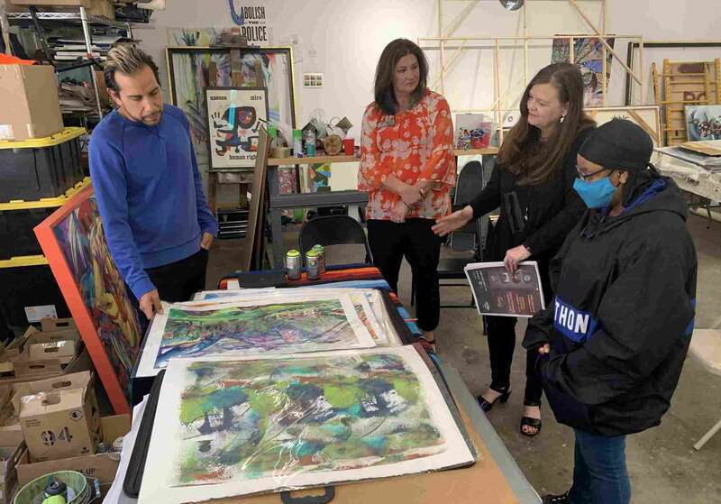 Pickens Museum and NOC Announce Mural by Osage Artist Yatika Starr Fields. Representatives from NOC visit Yatika Starr Fields in his Tulsa Studio to discuss the mural Fields will paint at the NOC Tonkawa campus. From left Yatika Starr Fields, Sheri