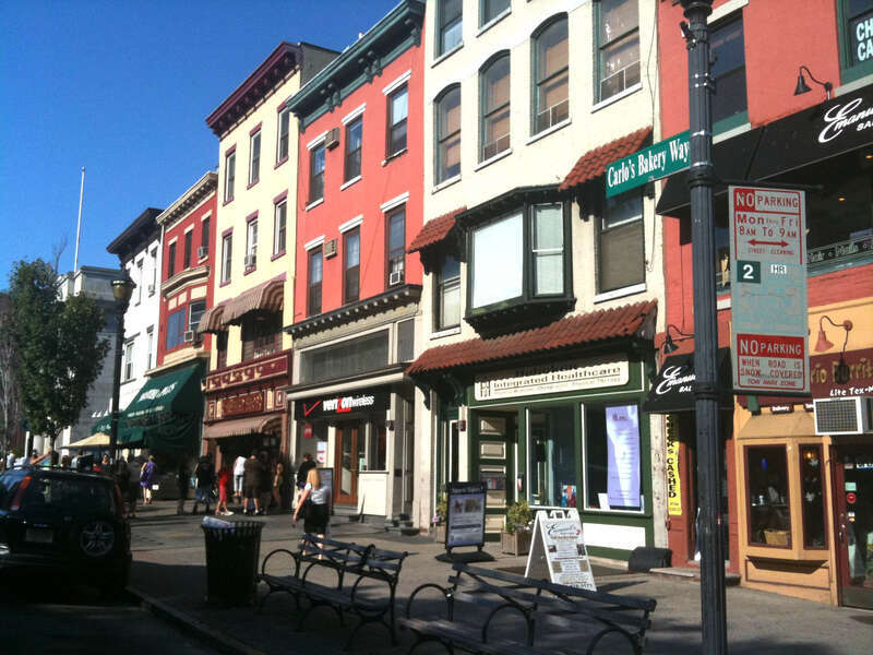Sign denoting the section of Washington Street in Hoboken, New Jersey that has been renamed Carlo's Bakery Way, in honor of Carlo's Bake Shop, the business (seen just to the right of the green awning) known as the setting for the reality TV series