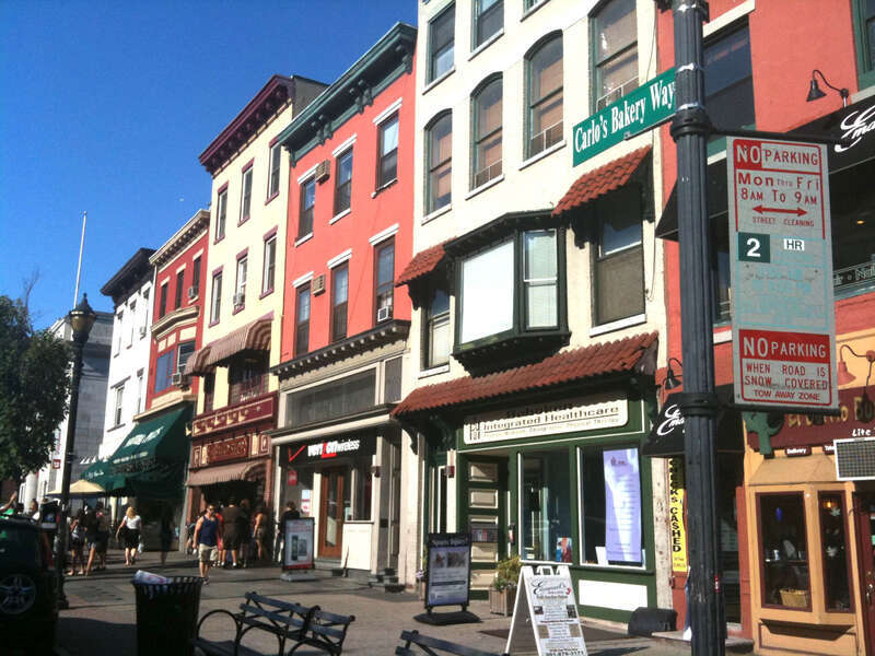 Sign denoting the section of Washington Street in Hoboken, New Jersey that has been renamed Carlo's Bakery Way, in honor of Carlo's Bake Shop, the business (seen just to the right of the green awning) known as the setting for the reality TV series