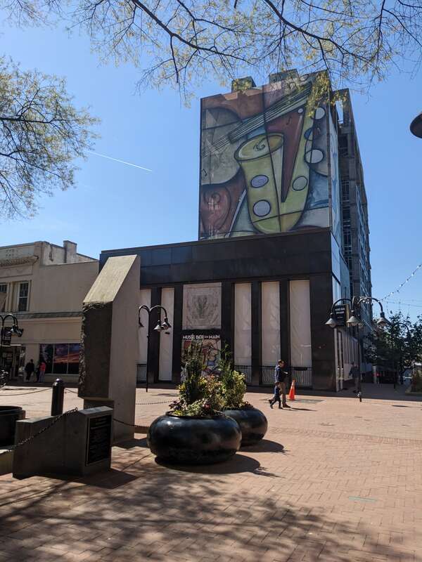 Dewberry Living abandoned construction located at 201 East Water Street (in background), seen from Downtown Mall in Charlottesville, Virginia.