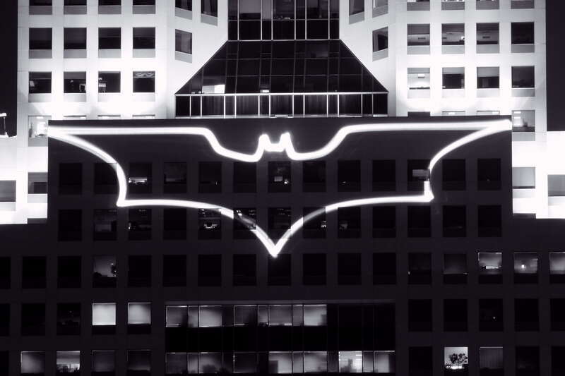 The Bat-Signal displayed on the Fifth Avenue Place in Pittsburgh during the filming of The Dark Knight Rises.