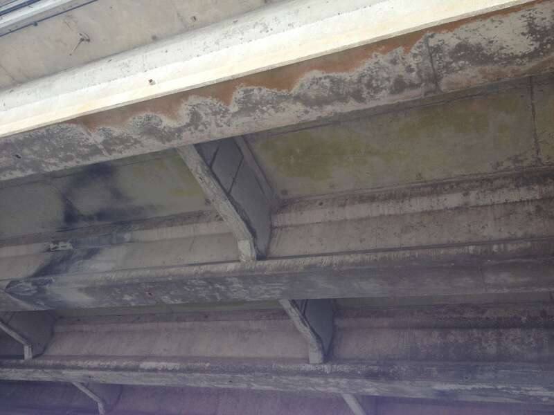Shows previous repairs on underside of bridge deck