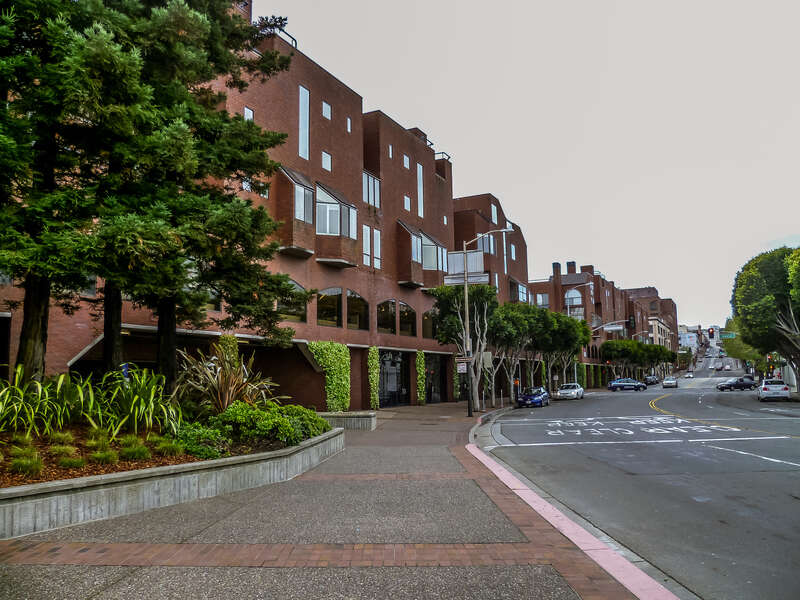 On Broadway facing west in Northern Waterfront/Embarcadero district of San Francisco. Gateway Plaza visible on the left. Davis Street visible in the background.