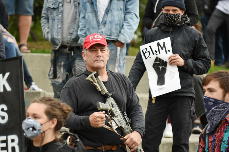 Counter-protester wearing Donald Trump campaign paraphernalia at the March on Alaska.
March on Alaska event in Anchorage, Alaska. Presented by the Alaska Black Caucus. September 7, 2020.

This photo is available for free public use. Please provide