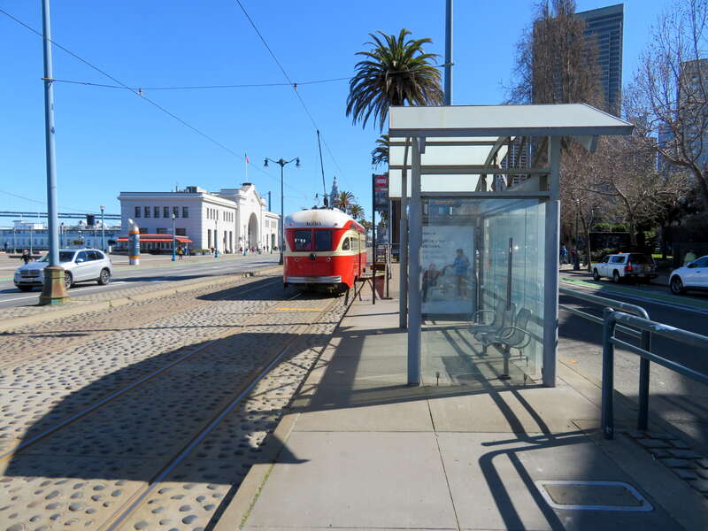 Muni 1050 southbound at Broadway and The Embarcadero station in March 2019