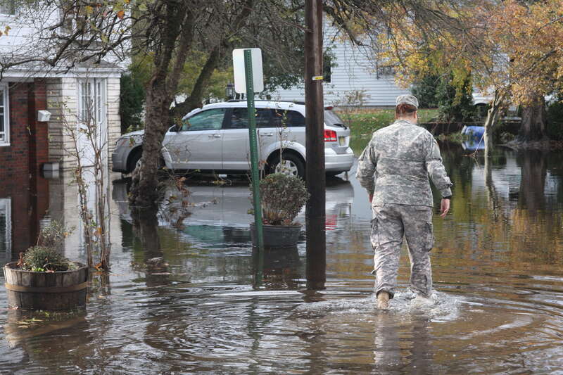 New Jersey National Guard soldiers assist displaced residents at the town of Hoboken Oct. 31. Four trucks and eight soldiers were dispatched to Hoboken at the request of the state Office of Emergency Management to assist in rescue efforts of