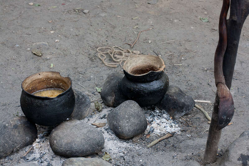 Cooking pots and spoon in Wampanoag village at Plimouth Plantation in Plymouth, MA