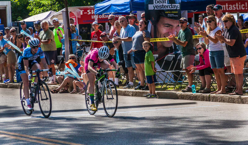 Winner and second place in the Women's bicycle race at Sunday's Yarmouth Clam Festival.  This is an attempt to get a stop action image.  There were lots of light challenges for me and this one has quite a bit of noise in the darker areas that I tried