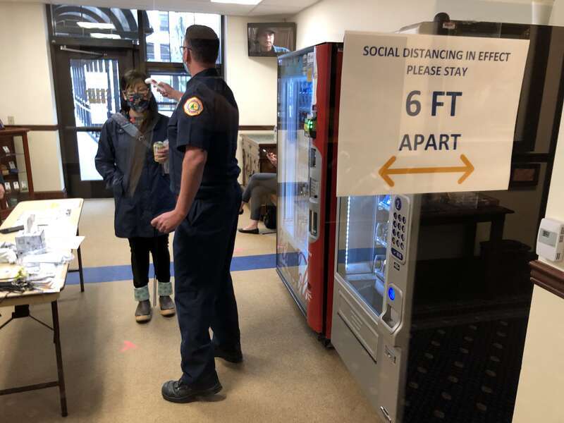Rep. Tiffany Zulkosky, D-Bethel, undergoes a health screening at the back entrance to the Alaska State Capitol on Monday, May 18, 2020. (James Brooks photo)